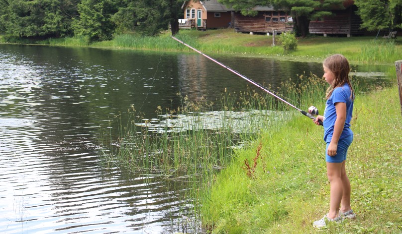 Junior camper fishing.