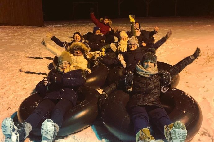 Group snow tubing at winter fun nights.